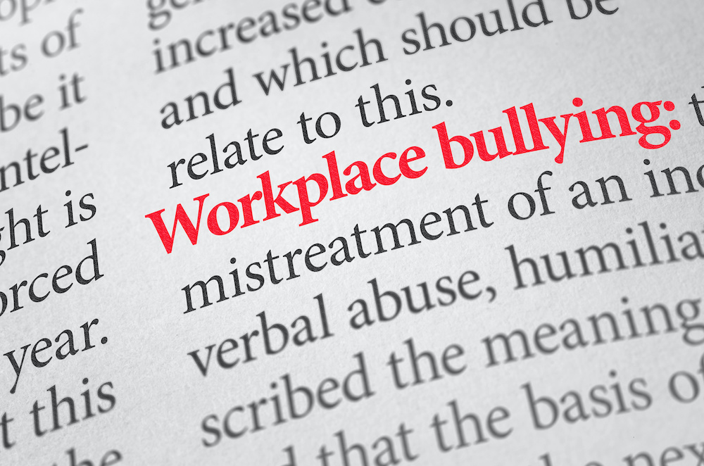 Definition of the term Workplace bullying in a dictionary
